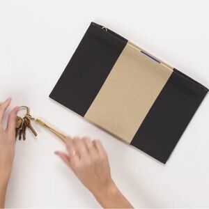 Rothys Essential Pouch Clutch Wristlet in Ink and Ivory